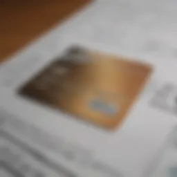 A close-up of a credit card against a backdrop of financial documents.