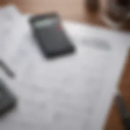 A close-up of financial documents and a calculator, symbolizing loan refinancing.